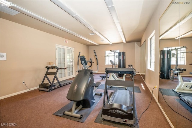 workout room with baseboards