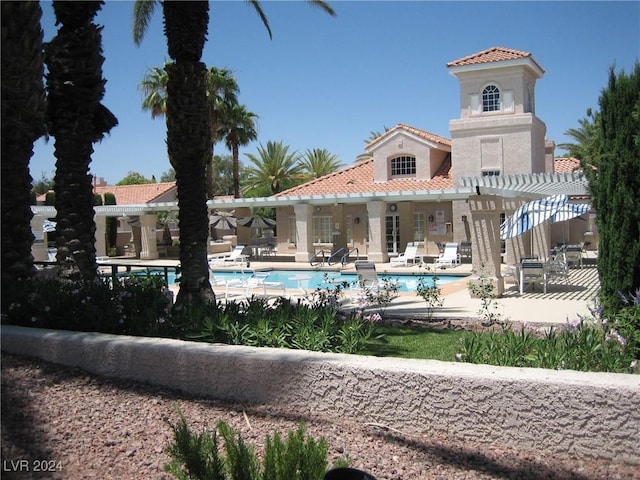 view of pool with a pergola and a patio area