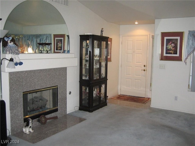 carpeted living room featuring a fireplace