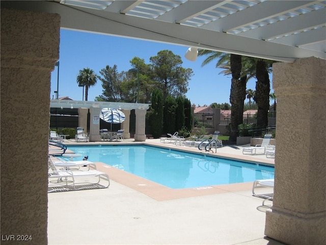 view of pool featuring a pergola and a patio