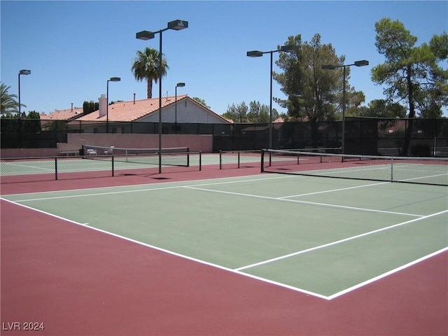 view of tennis court featuring basketball court