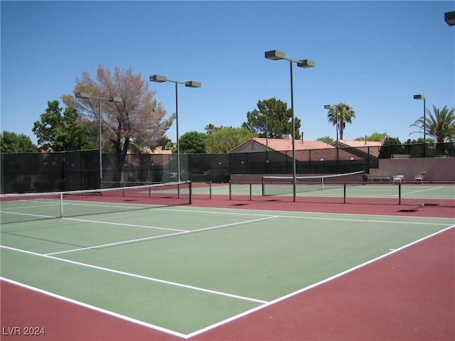 view of sport court featuring basketball hoop