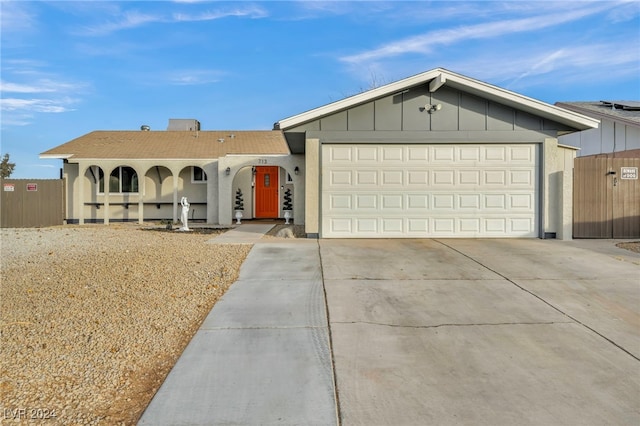 713 Antelope Way, Las Vegas, NV 89145 - ranch-style home with concrete driveway, a garage, and a porch