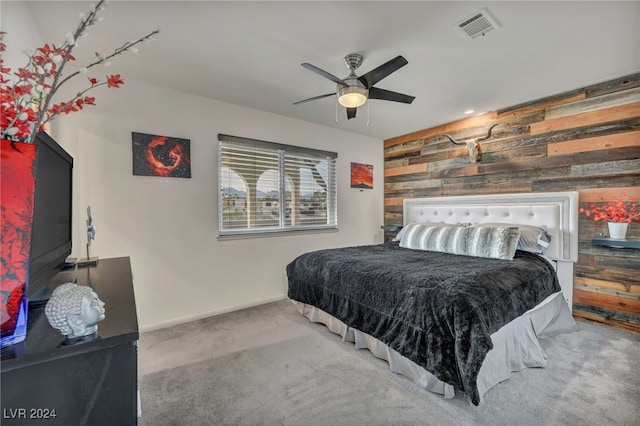 713 Antelope Way, Las Vegas, NV 89145 - carpeted bedroom featuring wooden walls, an accent wall, and a ceiling fan