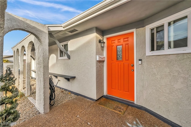 713 Antelope Way, Las Vegas, NV 89145 - doorway to property featuring stucco siding