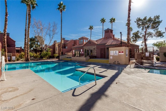 view of swimming pool with a patio area