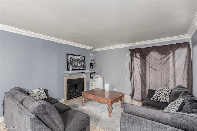 living room with a tile fireplace, light tile patterned floors, and ornamental molding