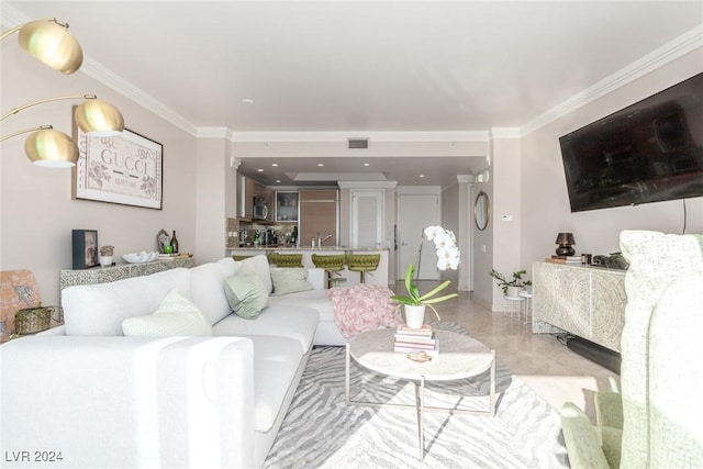 living room with sink and ornamental molding