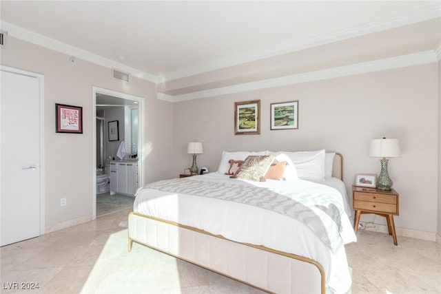 bedroom with ornamental molding and ensuite bathroom