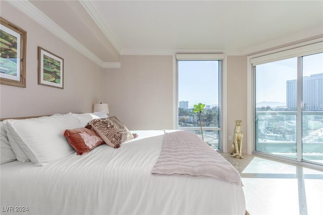 bedroom featuring ornamental molding and access to exterior