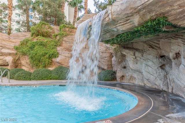 view of pool featuring pool water feature