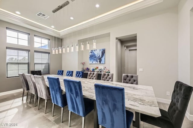 dining space featuring ornamental molding