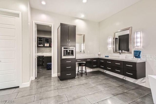 bathroom with vanity and tile patterned floors