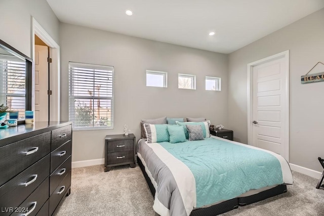 bedroom featuring light colored carpet