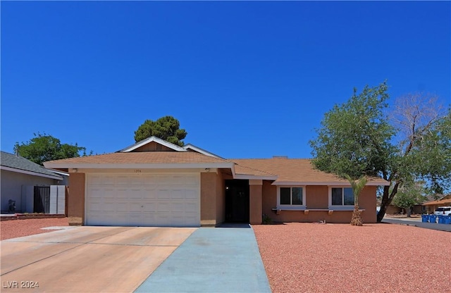 single story home with a garage