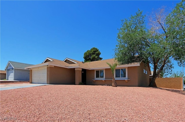 single story home with a garage