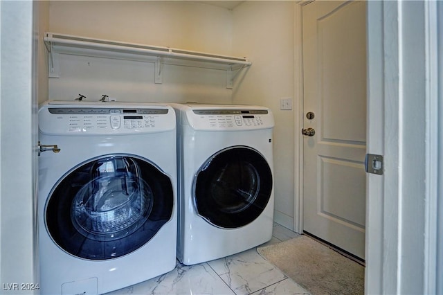 washroom featuring washer and clothes dryer