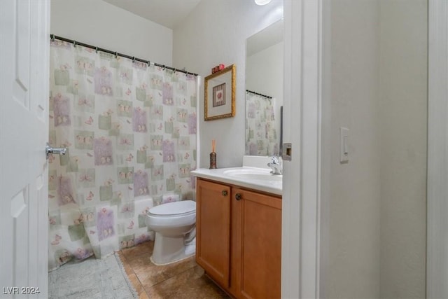 full bathroom featuring tile patterned flooring, shower / bath combination with curtain, vanity, and toilet