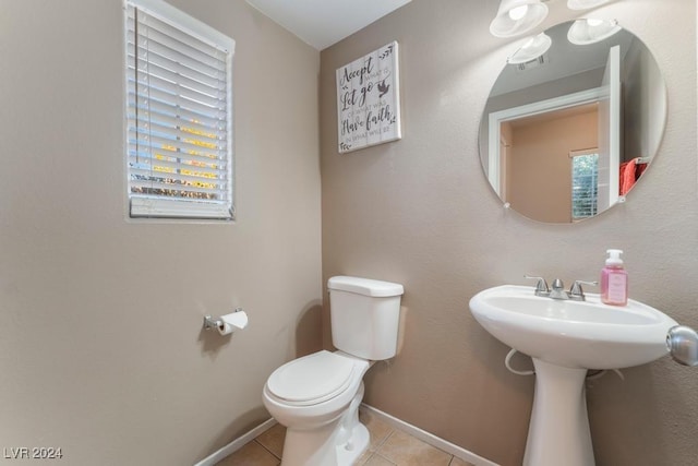 bathroom with tile patterned floors and toilet