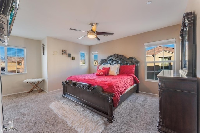 carpeted bedroom featuring ceiling fan