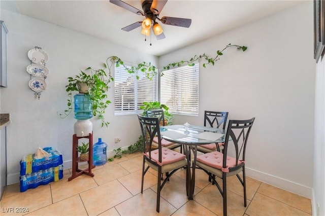 tiled dining area with ceiling fan