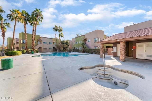 view of swimming pool with a patio area