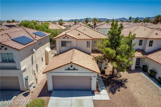 10142 Rice Paper St, Las Vegas, NV 89183 - mediterranean / spanish house with a residential view, stucco siding, and a tiled roof