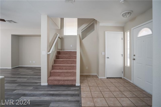 10142 Rice Paper St, Las Vegas, NV 89183 - entryway featuring stairs and light wood-style flooring
