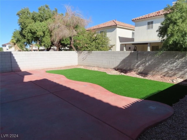 10142 Rice Paper St, Las Vegas, NV 89183 - fenced backyard with a patio