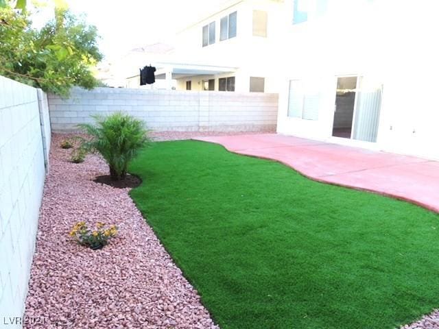 10142 Rice Paper St, Las Vegas, NV 89183 - fenced backyard featuring a patio