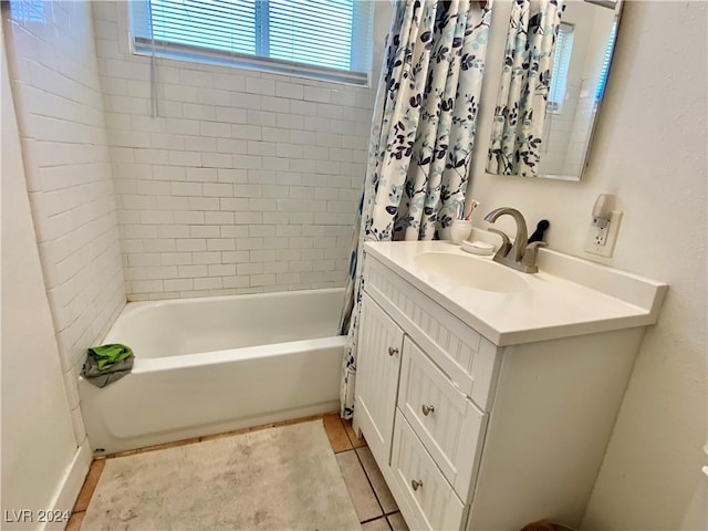 bathroom with tile patterned floors, vanity, and shower / bath combo