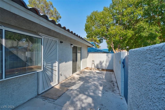 view of side of property with a patio area