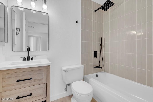 full bathroom featuring vanity, toilet, wood-type flooring, and tiled shower / bath