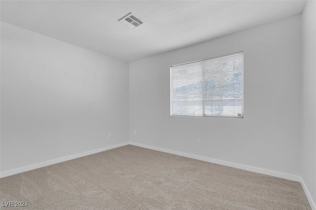 unfurnished room featuring carpet floors