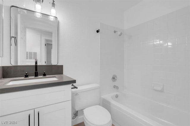 full bathroom with vanity, toilet, and tiled shower / bath