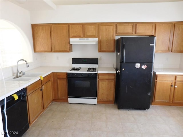 kitchen featuring sink and black appliances