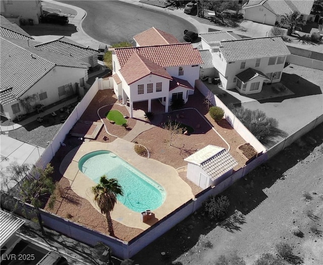 view of front of property featuring a balcony and a garage