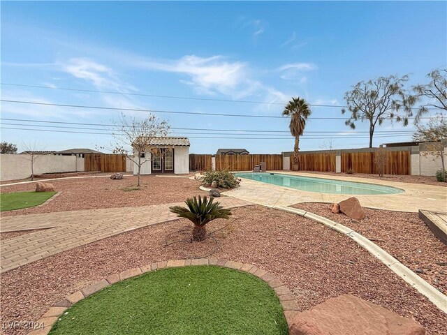 view of swimming pool featuring a patio area, a fenced backyard, and a fenced in pool