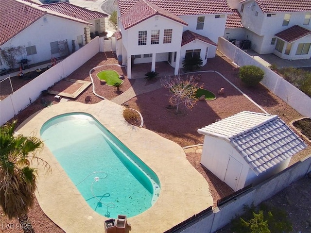 view of swimming pool featuring a patio, a fenced backyard, and a jacuzzi