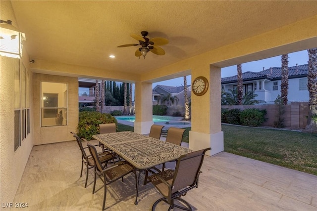 view of patio / terrace featuring ceiling fan