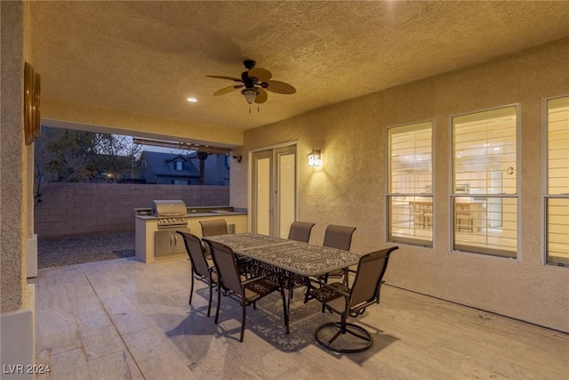 view of patio with ceiling fan and exterior kitchen