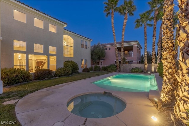 view of pool featuring an in ground hot tub