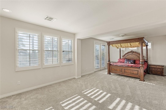 bedroom with light carpet