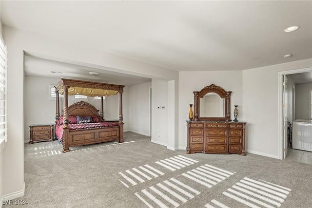 bedroom featuring light carpet