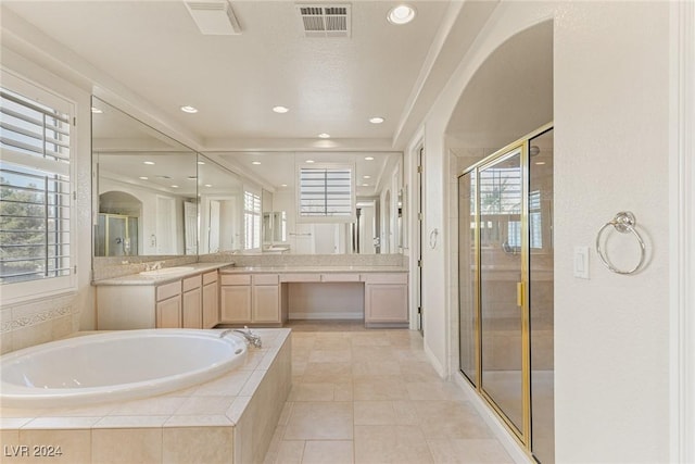 bathroom with tile patterned floors, vanity, and independent shower and bath