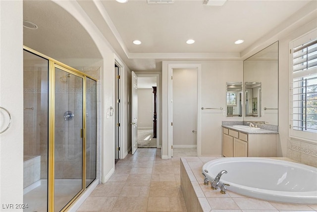 bathroom featuring tile patterned flooring, vanity, and independent shower and bath