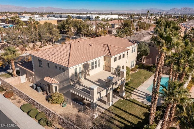 birds eye view of property with a mountain view