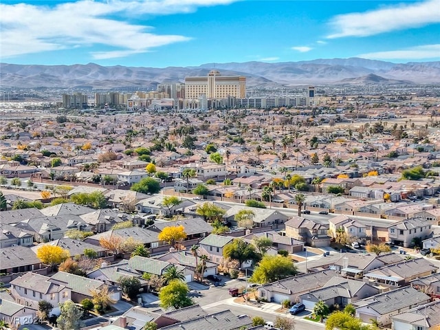 birds eye view of property with a mountain view