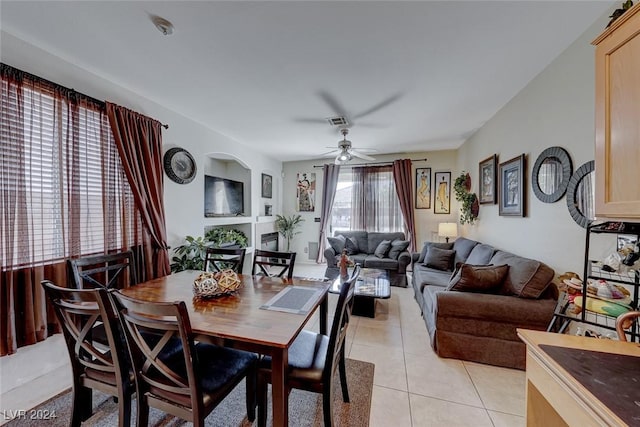 dining room featuring ceiling fan and light tile patterned flooring