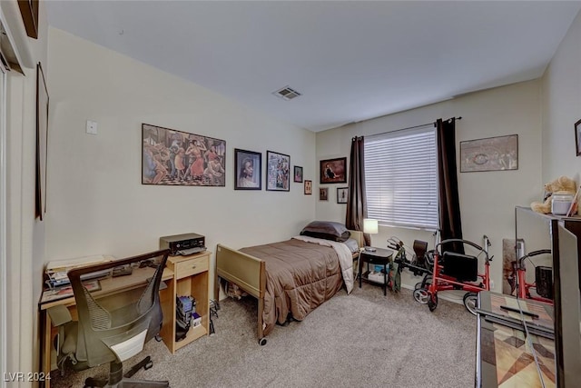 bedroom featuring light colored carpet